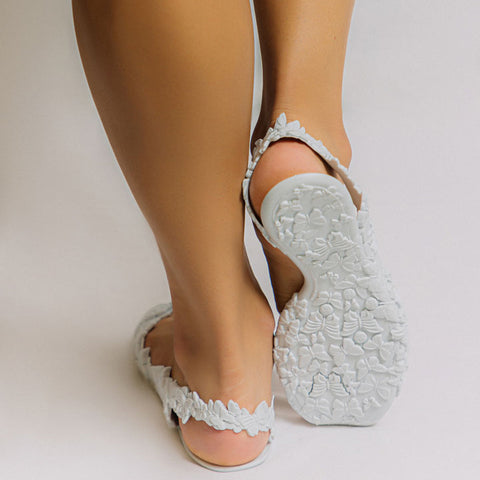 Girl wearing white flat sandals
